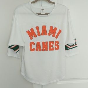 Pink Miami Hurricanes jersey style shirt